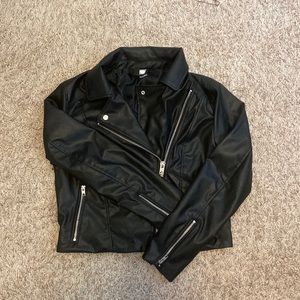 Leather jacket with silver zippers. Lightly worn